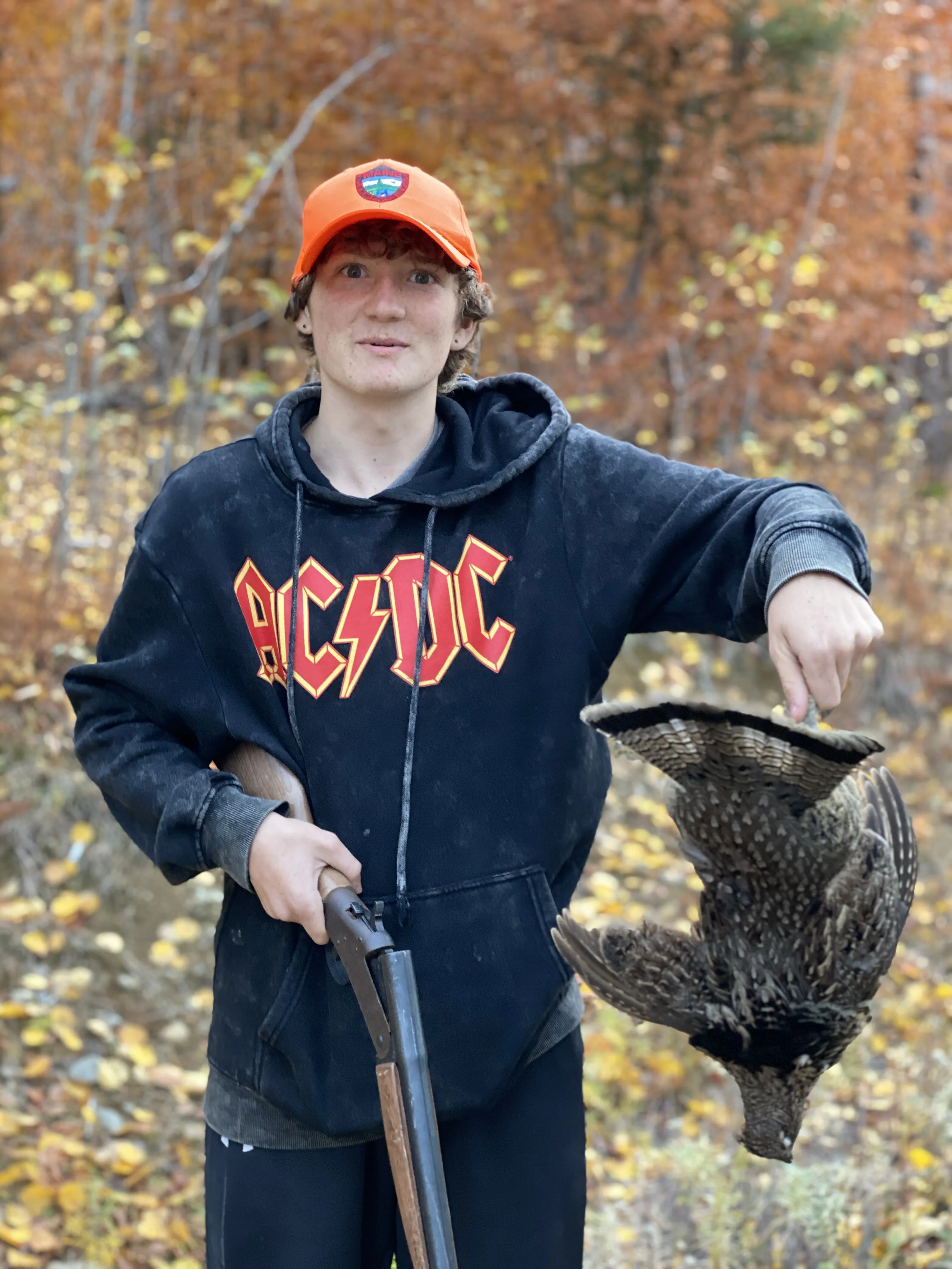 Young hunter and grouse